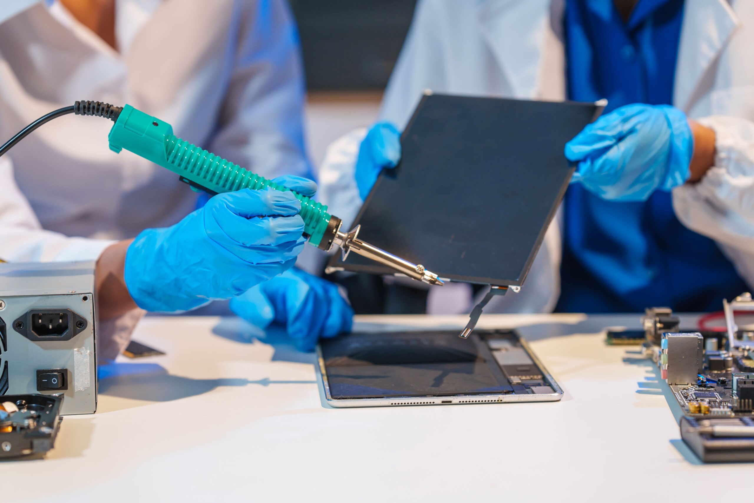 close up of a technician wearing gloves soldering 2025 02 16 07 36 30 utc scaled