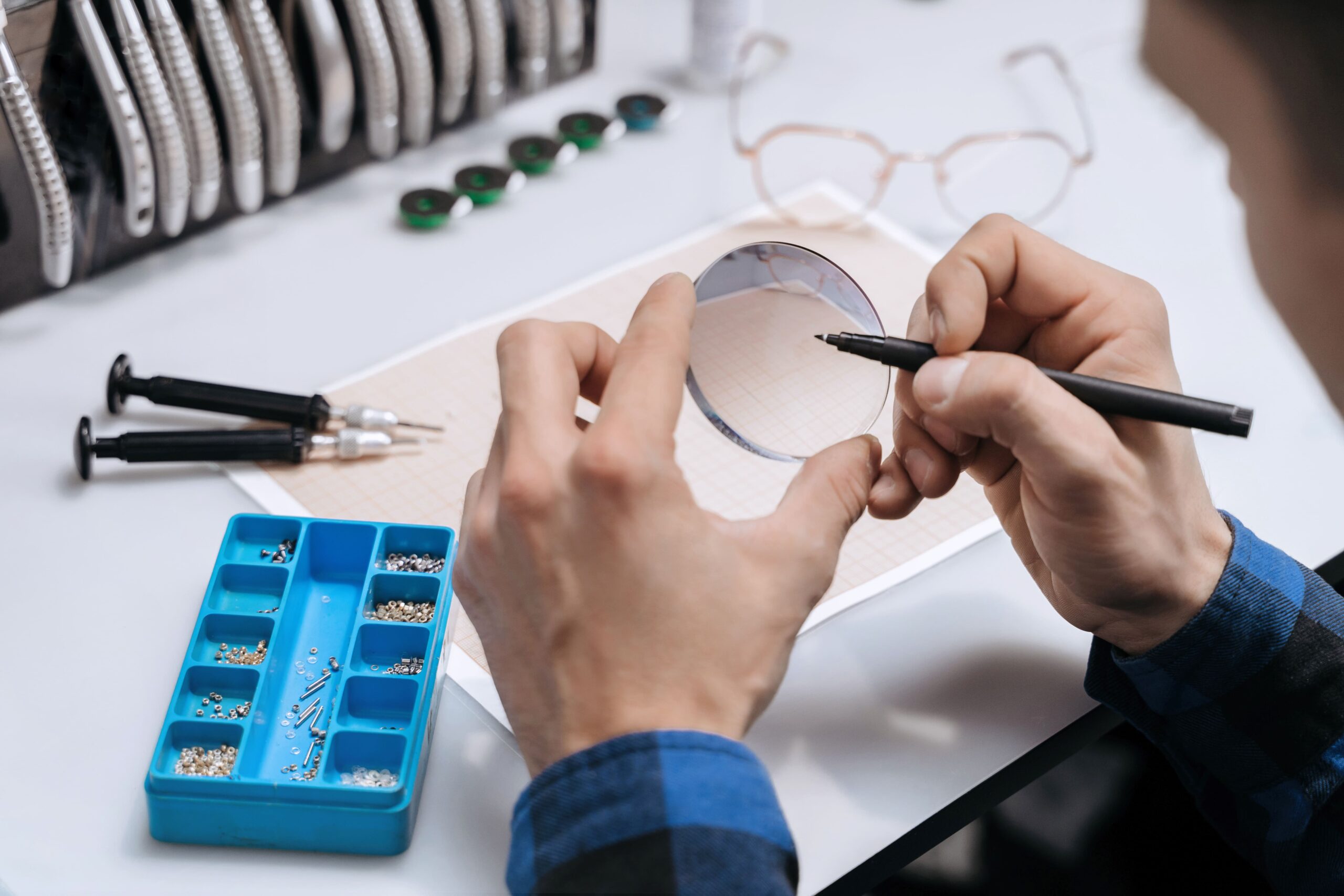 closeup of man s hands marking lens for eyeglasses 2025 01 08 03 30 59 utc scaled