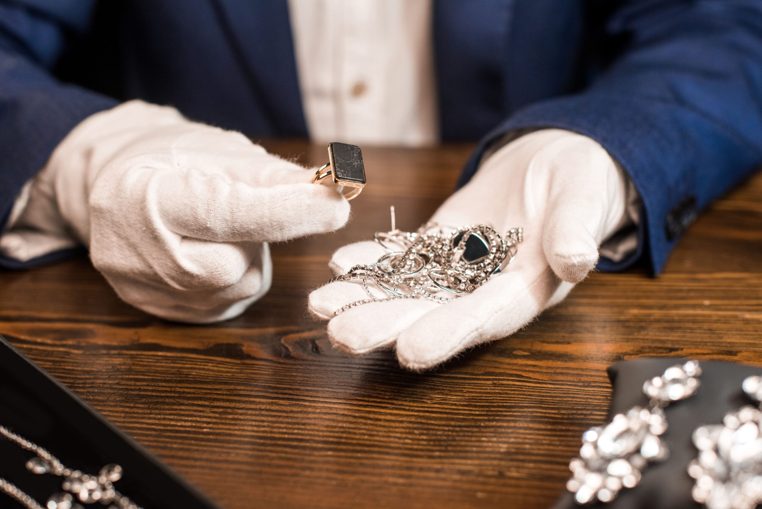 cropped view of jewelry appraiser holding ring and 2024 11 17 15 13 27 utc scaled