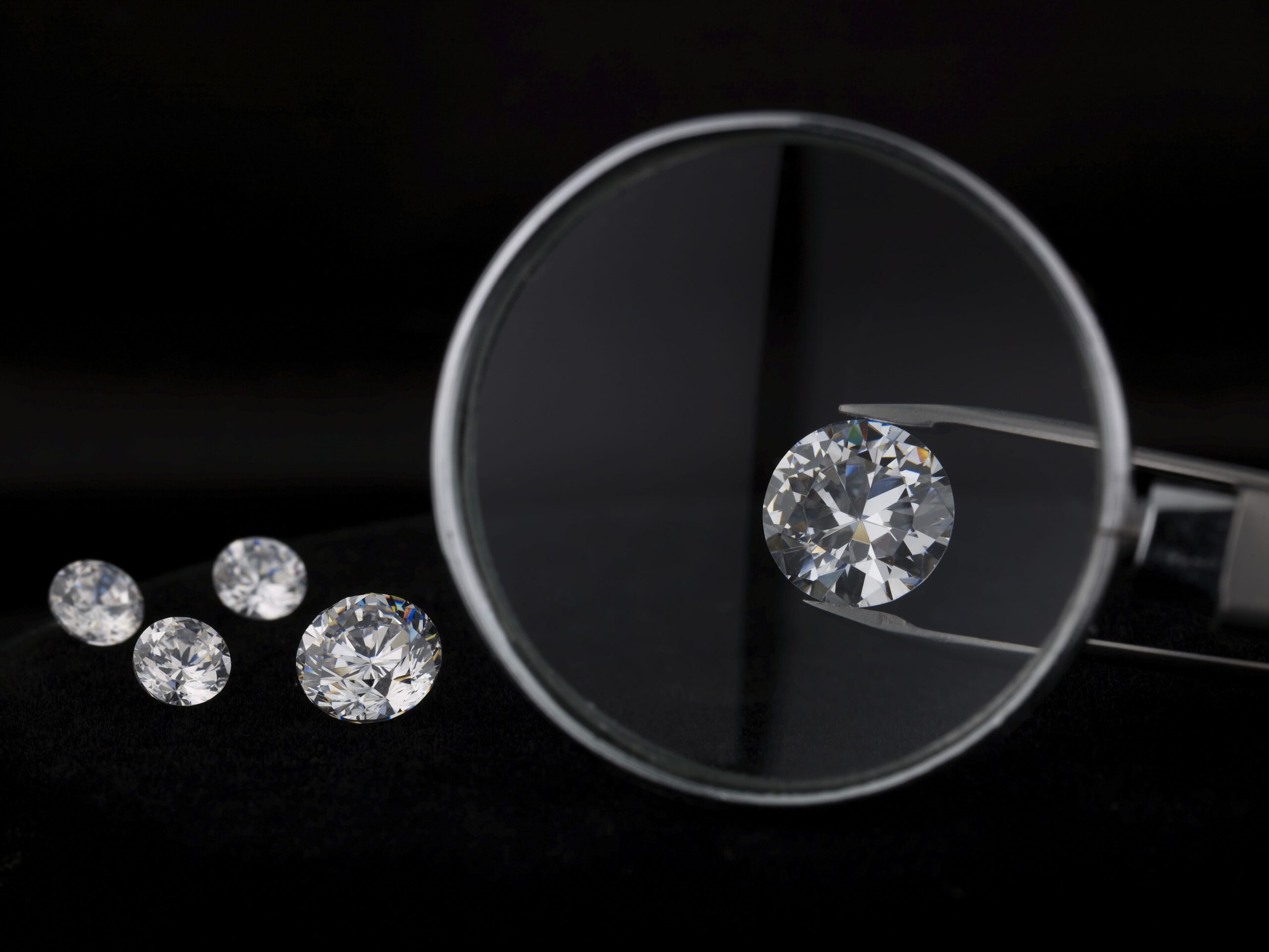magnifying glass over diamond 2024 09 16 15 56 27 utc 1 scaled