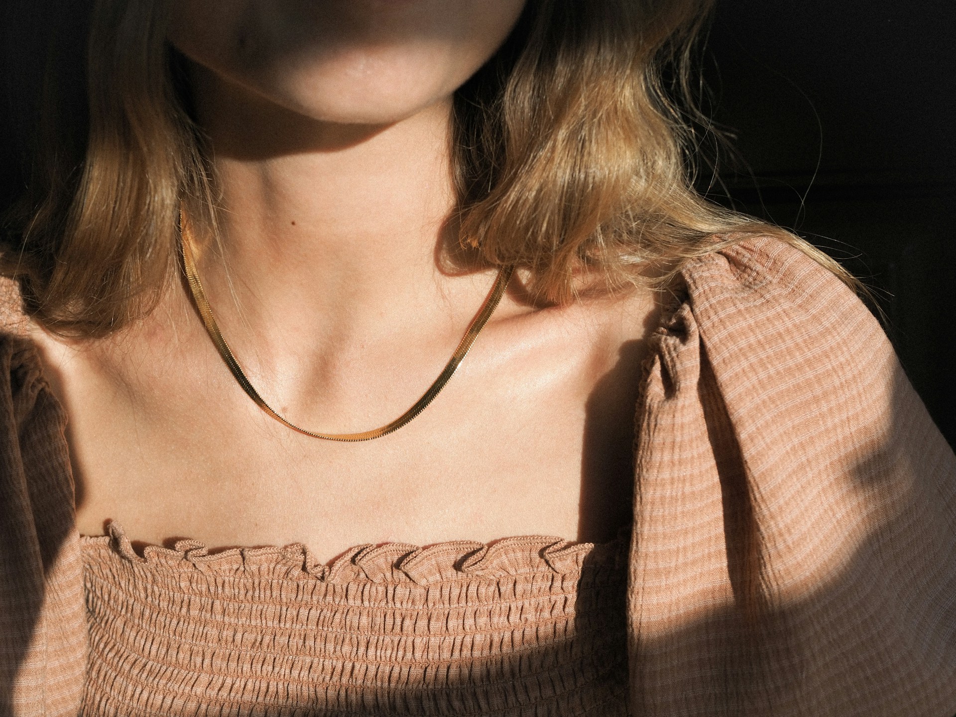 woman wearing necklace